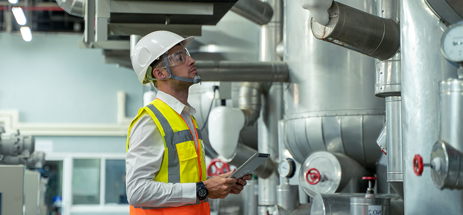 man checking compressed air tanks